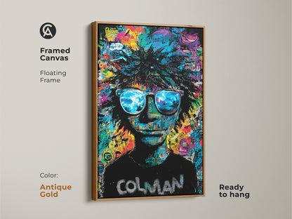 Framed canvas art in an antique gold floating frame. Ready to hang. This Colman artwork features a person with sunglasses. The lenses reflect a beach scene. The background has colorful graffiti. Add elegance with this framed art.