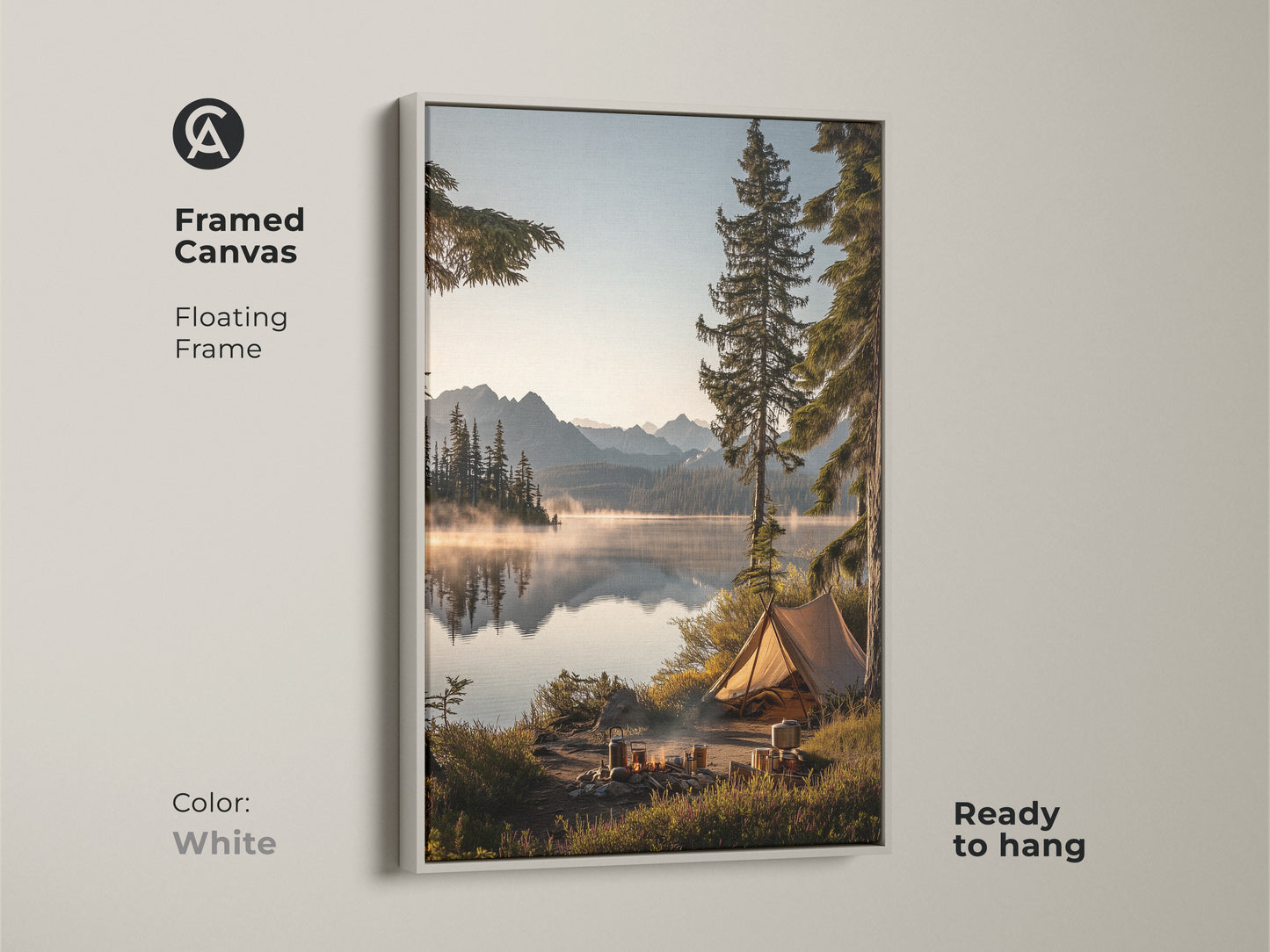 Framed canvas in white showcasing mountain lake camping art. The floating frame highlights this outdoor adventure wall decor. It features a rustic tent canvas print. Ready to hang this nature landscape brings a cozy cabin art atmosphere. This serene lake view print is ideal as a housewarming gift.