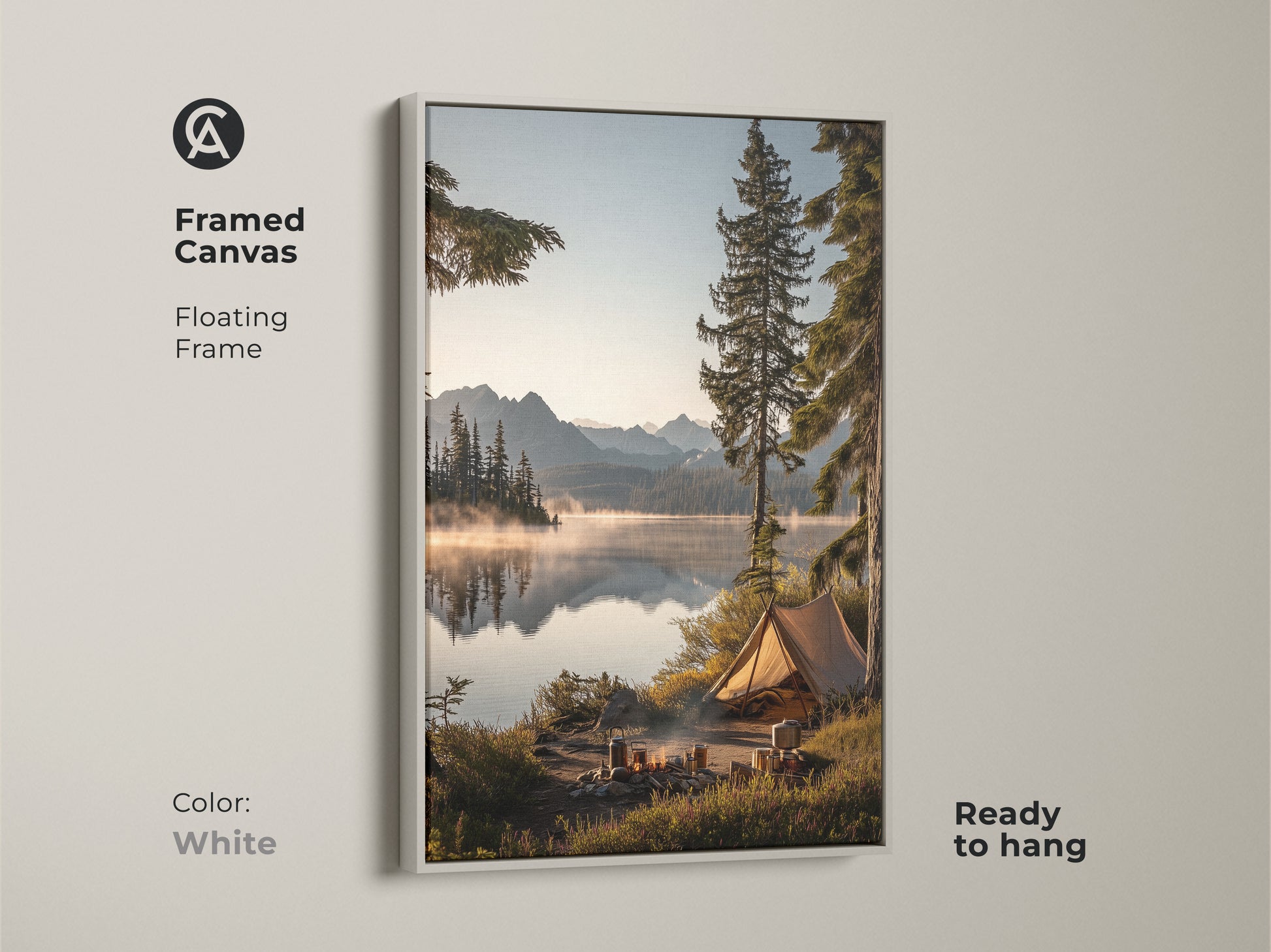 Framed canvas in white showcasing mountain lake camping art. The floating frame highlights this outdoor adventure wall decor. It features a rustic tent canvas print. Ready to hang this nature landscape brings a cozy cabin art atmosphere. This serene lake view print is ideal as a housewarming gift.