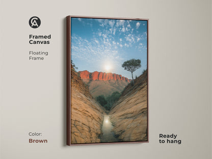 Transform your space with this framed canvas featuring an Australian desert canyon. The brown floating frame complements the orange and blue tones of this nature artwork. Ready to hang this red rock landscape print is ideal for residential or office wall art. A unique travel gift idea.