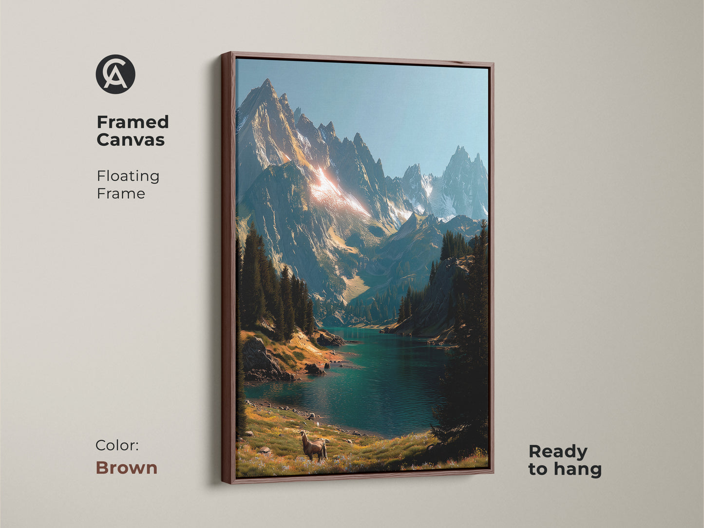 Mountain lake framed canvas artwork with a brown floating frame. The artwork is ready to hang and depicts a gorgeous landscape. It has majestic mountains a still lake and a deer. Bring the beauty of nature into your home.