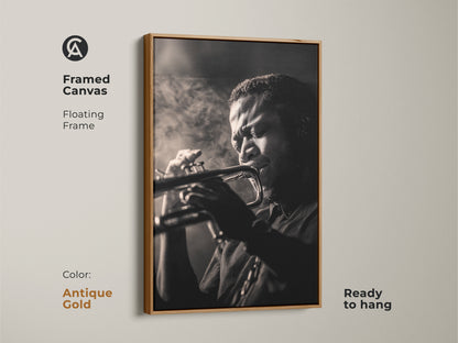 A framed canvas in antique gold features a black and white photo. The musician is performing with passion on the trumpet. The floating frame gives a classic look. Ready to hang this framed art. Elevate your decor with this art!