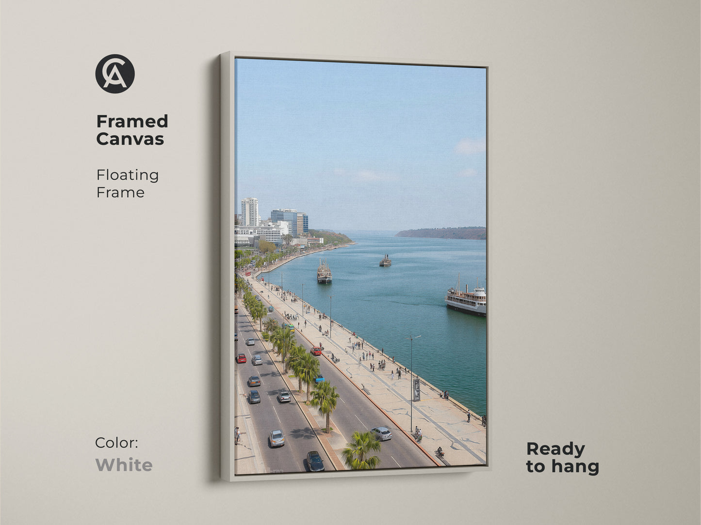 Framed canvas artwork featuring a blue teal coastal cityscape. The white floating frame enhances the travel photography. Palm trees line the street. Perfect for entry hall decor. Contemporary seaside art.