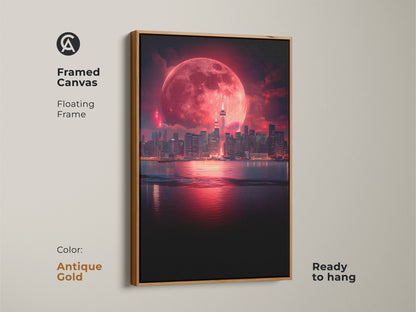 Framed canvas art displaying a surreal cityscape under a vibrant red moon. The antique gold floating frame adds a touch of elegance. Ready to hang this fantasy landscape art is perfect for a romantic cityscape decor. A unique gift idea for him