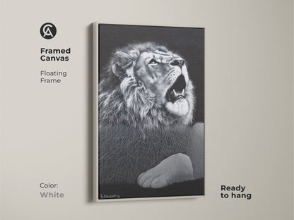 White framed monochrome lion canvas. This floating framed wildlife decor is ready to hang. It's suited for a contemporary bedroom or office. Bring a touch of the savanna wildlife to your walls.