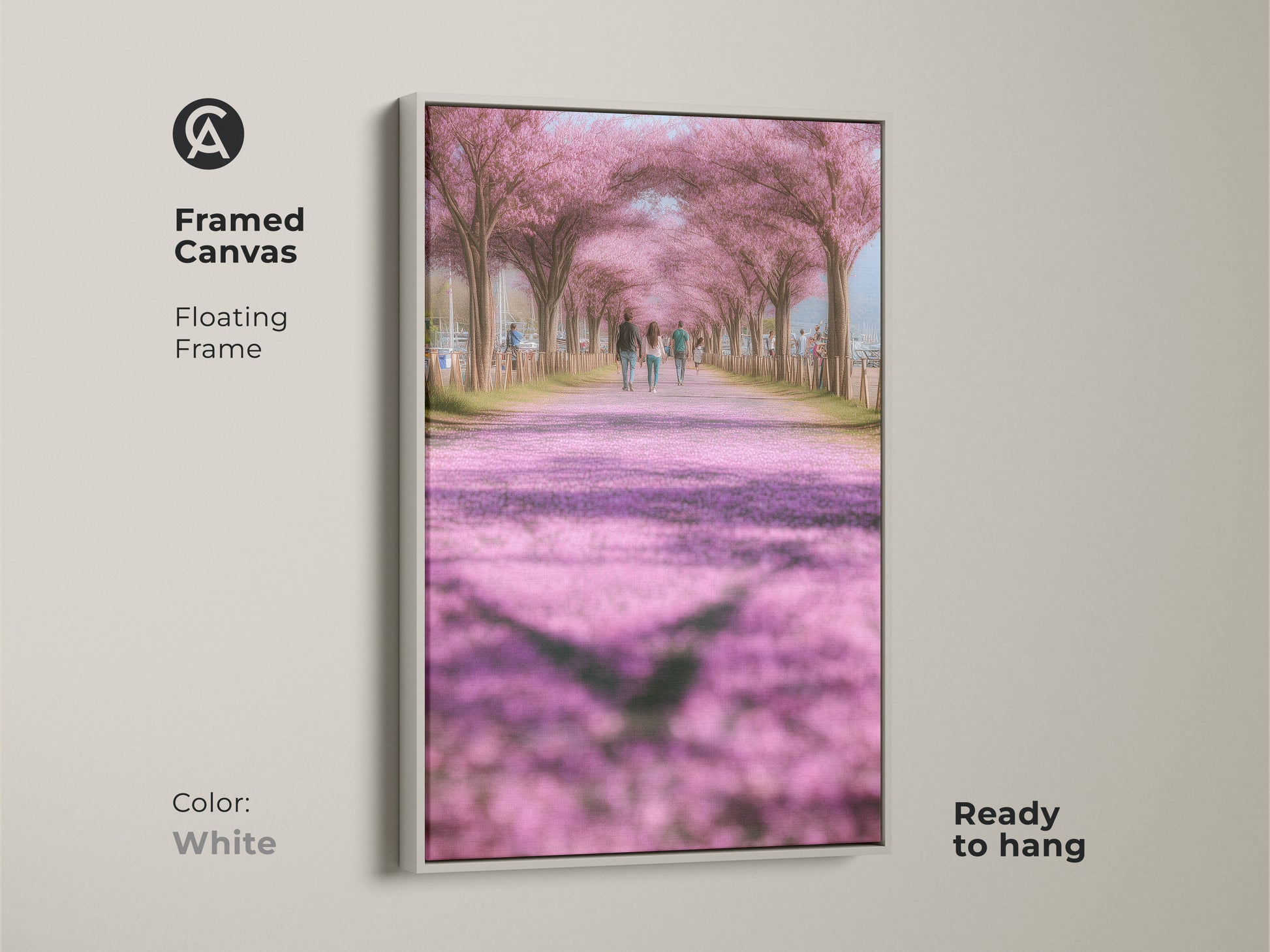 White framed canvas art print of a cherry blossom lined path. Ready to hang this artwork brings a romantic spring feel to your decor. The soft pink and green hues create a calming atmosphere. Suitable for modern farmhouse style. Makes a thoughtful gift for nature lovers.