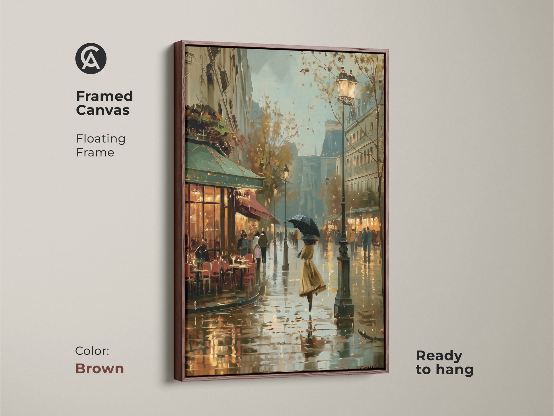 Framed canvas of a Parisian cafe on a rainy day. The floating frame in brown complements the impressionistic style of this cityscape artwork. This European street scene decor features a woman with an umbrella. It's a ready to hang piece perfect for adding a vintage touch to your dining room.