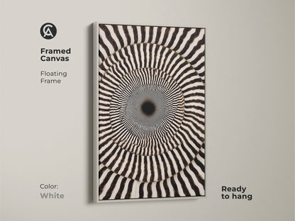 Framed Canvas showcasing Abstract Geometric Wall Art. Its Op Art Concentric Circles form a Psychedelic Swirl. The monochrome den decor is ready to hang. The white floating frame enhances the modern abstract artwork.