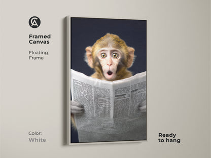 This framed canvas features a monkey engrossed in reading a newspaper artwork. The floating white frame adds a clean modern touch. Ready to hang this animal themed wall art brings humor to your space. Ideal for eclectic home decor and office spaces. This whimsical animal print makes a unique birthday gift for animal lovers. The unique wall hanging is a perfect conversation starter.