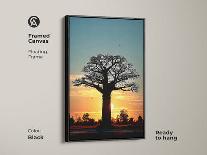 Black framed canvas of a sunset baobab tree. This African silhouette landscape art is ready to hang. The floating frame enhances the boho bedroom wall decor. A unique and serene nature landscape canvas.