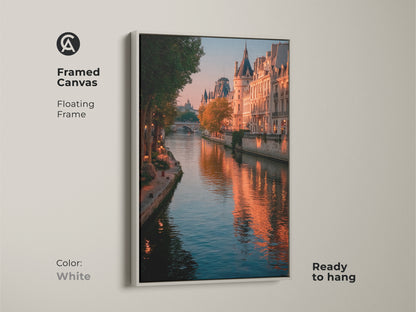 Framed canvas art featuring a Parisian cityscape. The white floating frame highlights the Seine River photography. The golden hour enhances the Parisian buildings. This ready-to-hang piece adds contemporary decor. Bring the elegance of France into your home with wall art. It is romantic.