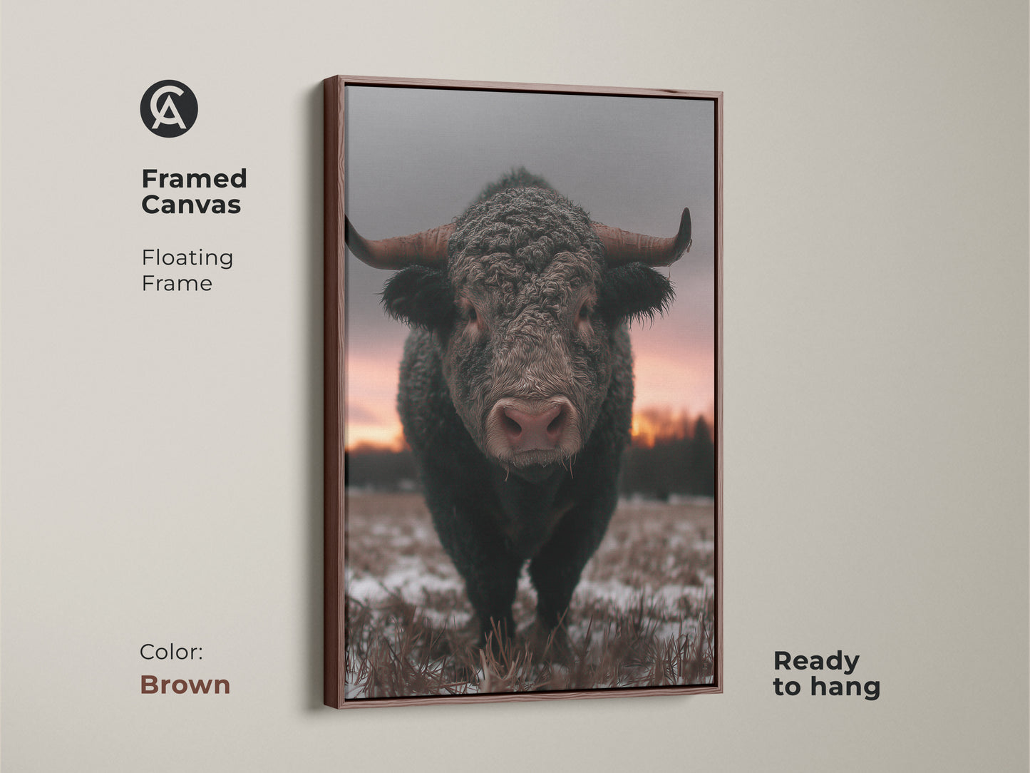 Framed canvas featuring a photorealistic bull in a winter scene. Brown floating frame complements this rustic farmhouse wall art. Wildlife animal print ready to hang for easy decor. Brown gray pink art perfect for country chic wall art. A cozy bedroom art piece.