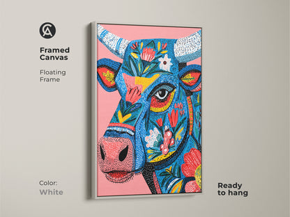 Framed canvas print of a floral bull artwork with a white floating frame. This artwork is ready to hang. The clean white frame allows the colorful art to stand out. This animal art print is perfect for a minimalist home. Shop this unique print today.