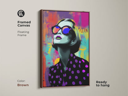 Framed canvas of a Pop Art woman with a brown floating frame. This contemporary bedroom decor is ready to hang. Its abstract face wall art features purple pink and teal.