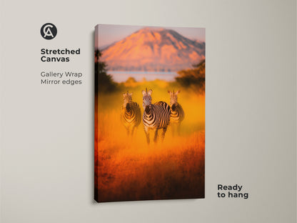 Stretched canvas featuring a photorealistic zebra print in an African savanna. This gallery-wrapped wildlife artwork has mirrored edges and is ready to hang. Warm earth tone colors perfect for eclectic home decor or as a unique housewarming gift. Animal print brings the wild into your living room.