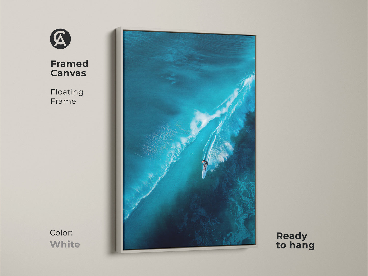Framed canvas artwork depicting a surfer riding a large wave. The floating frame is white. The ready-to-hang art offers a clean aesthetic. It's a versatile addition to any contemporary home.