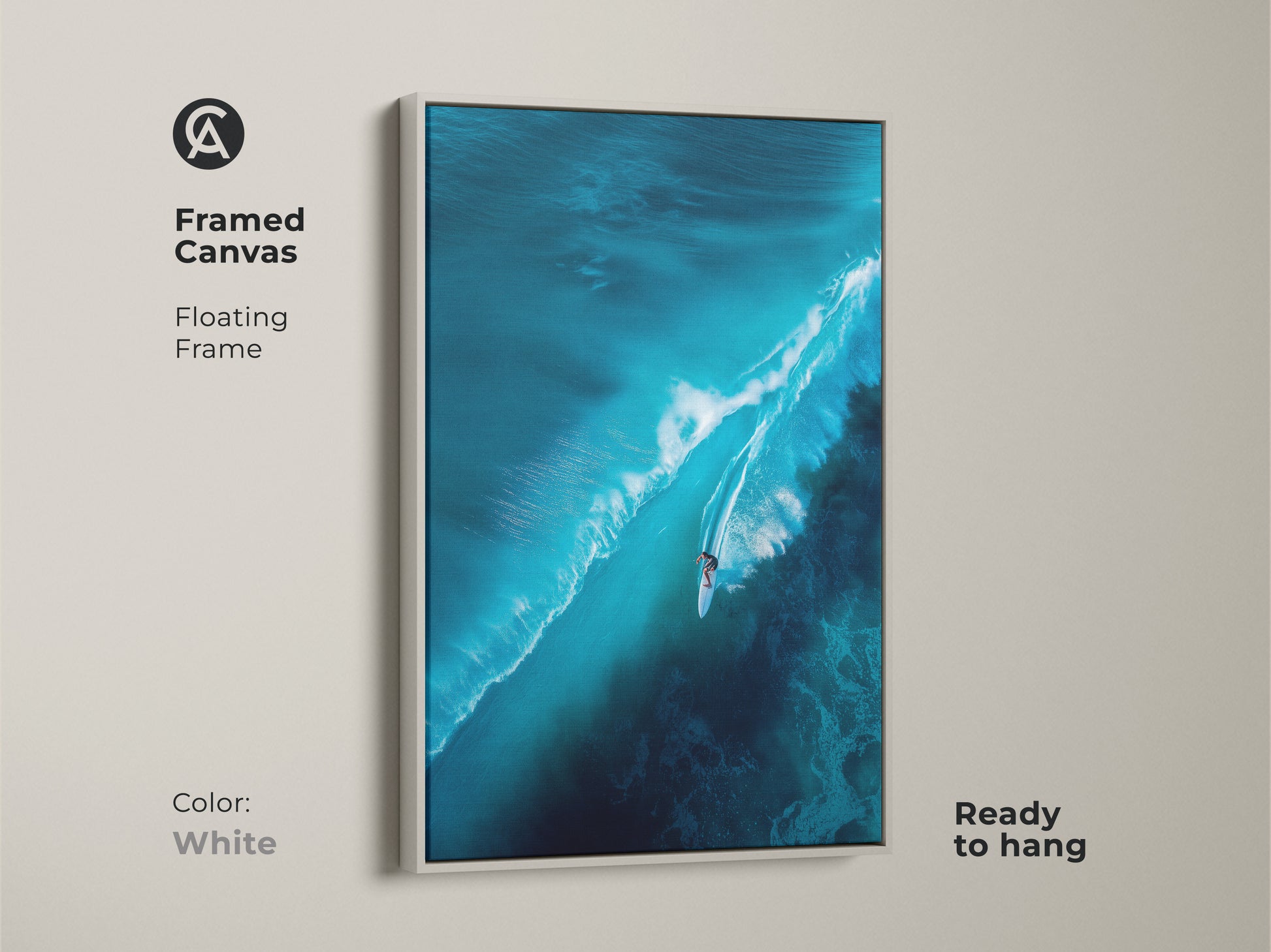 Framed canvas artwork depicting a surfer riding a large wave. The floating frame is white. The ready-to-hang art offers a clean aesthetic. It's a versatile addition to any contemporary home.