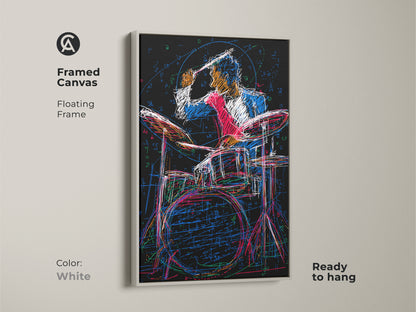 A white framed canvas with floating frame. The artwork features an abstract drummer sketch in bold red blue and black lines. This canvas is ready to hang. A perfect artistic touch for music themed decor.
