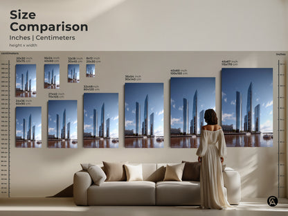 Size comparison for modern cityscape art in inches and centimeters. Visualize the scale of this building artwork above a sofa. Ranging from small to large sizes this steel blue canvas art enhances urban explorer decor as a new home gift.