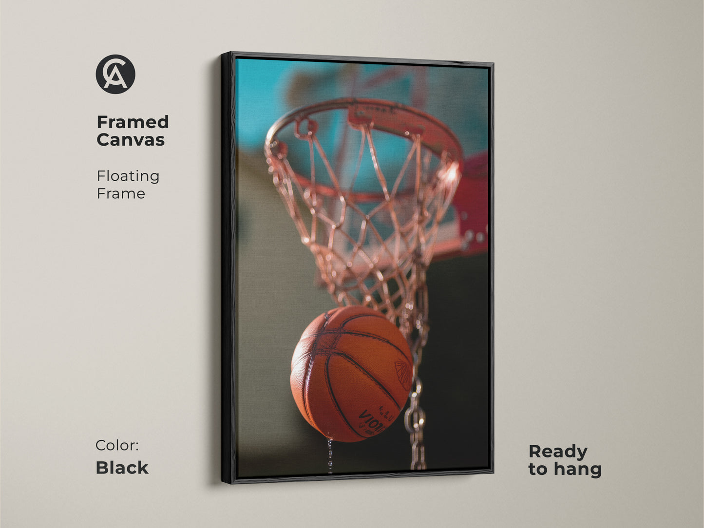 This is a framed canvas featuring basketball hoop artwork. This action shot basketball print has a floating frame. The black frame is ready to hang. The orange and teal sports decor will complement modern interiors. This sports room wall decor brings excitement.
