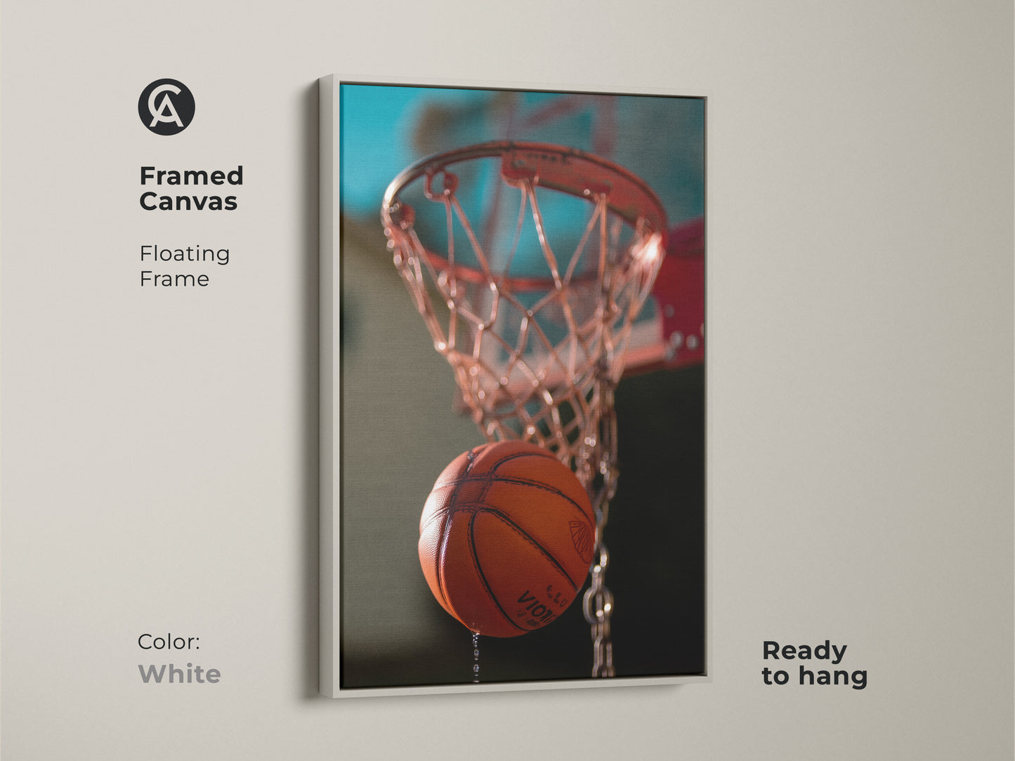 This is a framed canvas featuring orange hoop artwork. This action shot basketball print has a floating frame. The white frame is ready to hang. The teal background art would complement a sports-themed interior. Consider this basketball enthusiast gift.