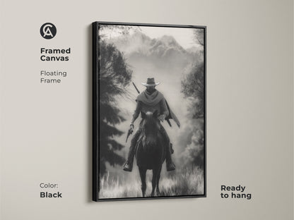 Framed canvas art presenting a monochrome cowboy on horseback. The floating frame adds a modern touch to this black Western landscape art. Ready to hang this piece is perfect for a rustic study room or home office. A classic adventure themed artwork.