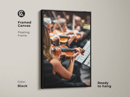 Framed in black this canvas art print captures an orchestra in full swing. A violinist is prominently featured. The floating frame adds depth to the artwork. Ready to hang this piece is ideal for office or home decor. Celebrate classical music with this elegant art.