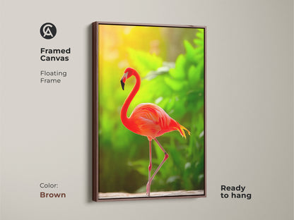 Framed canvas art of a tropical flamingo. The coral orange bird stands out beautifully. This wildlife artwork suits any room. A great boho bedroom decor choice. Ready to hang with a brown frame. It brings nature and art together.