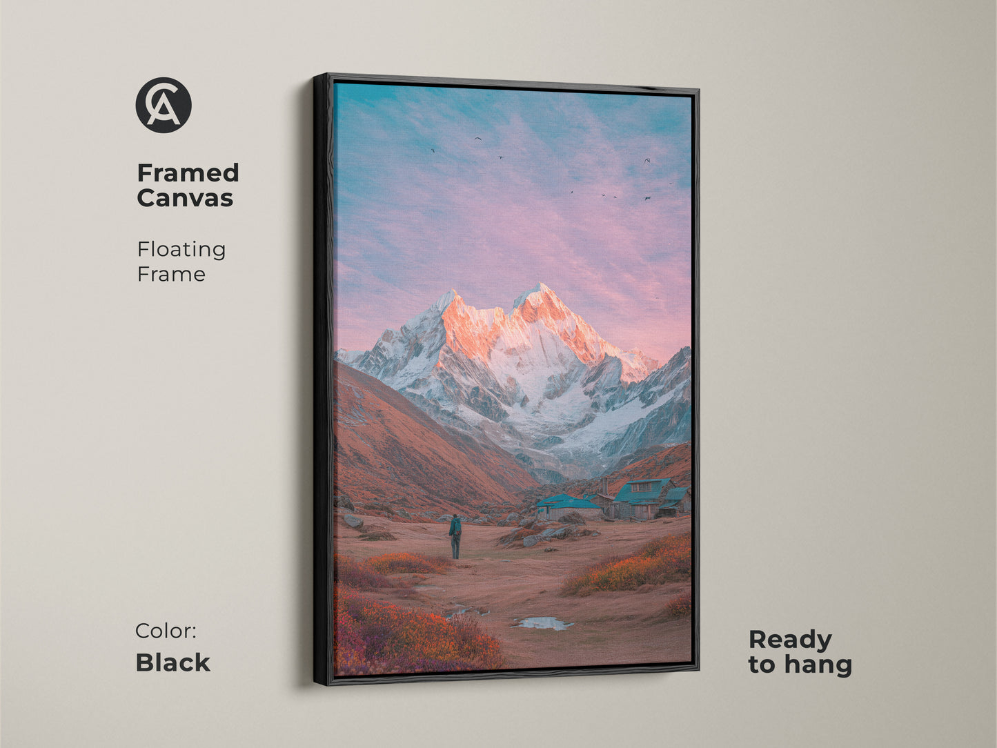 Black framed canvas art of a mountain scene. A snow-covered peak is illuminated by a warm glow. This floating frame adds a touch of elegance. Ready to hang and enjoy. A perfect piece of mountain artwork to complement your decor.