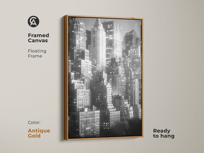 This framed canvas features a floating frame in antique gold. The black and white skyline artwork is ready to hang. Elevate your space with this timeless NYC cityscape art.