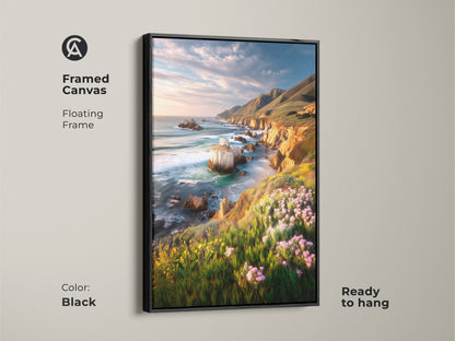 Framed canvas art of a coastal cliff ocean landscape in a black floating frame. Ready to hang this art features vibrant wildflowers and a scenic ocean view. It adds a touch of coastal living to your home decor. Perfect housewarming gift for ocean lovers.