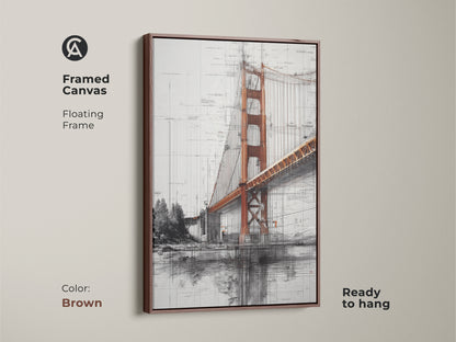 Framed Golden Gate Bridge canvas in a brown floating frame. The ready to hang blueprint style wall art is industrial. The orange and gray tones create a cityscape art piece. This architecture sketch print is a thoughtful travel lover gift. The engineering blueprint art is unique.