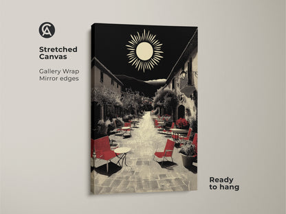 A stretched canvas displays Mediterranean village street artwork. Red seating accents are set against a black and beige color palette. This ready-to-hang European cafe decor captures a charming retro sun landscape. The gallery wrap and mirror edges create a housewarming art gift perfect for travel enthusiasts adding aesthetic wall decor.
