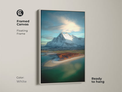 Framed canvas featuring coastal village snowy mountain art. This floating frame enhances the photorealistic mountain artwork. The white frame is ready to hang. It offers contemporary scenic beauty.