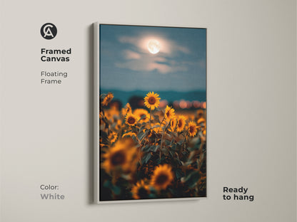 Framed canvas in white displaying sunflowers under a moonlit sky. This boho floral wall decor is ready to hang with a floating frame. The dreamy impressionistic print brings a soft and inviting touch to any room. Ideal as a gift.