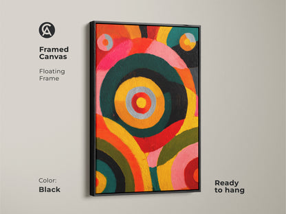 Framed canvas featuring abstract circles artwork with a black floating frame. Ready to hang geometric art print. The orange yellow pink hues of this modern eclectic artwork makes it great bedroom wall decor. This art is ideal for art lovers.