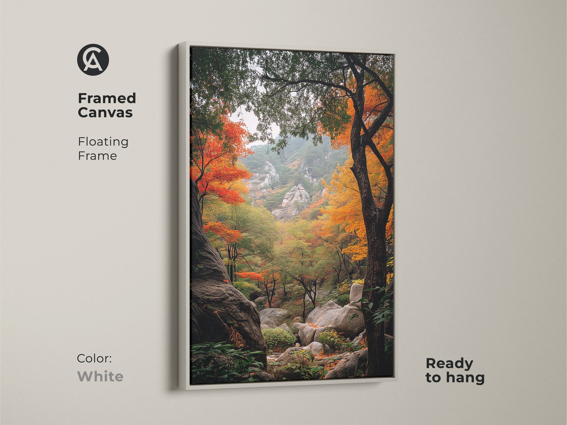 White framed canvas art highlighting an autumn forest landscape. The floating frame offers a clean modern look. This ready-to-hang artwork captures the beauty of fall. The landscape art features colorful trees and rocky terrain. Ideal for minimalist decor.