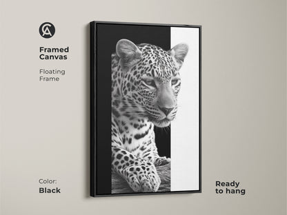 A framed canvas featuring a monochrome leopard. This floating frame comes in black and is ready to hang. A black and white wildlife art piece offering contemporary animal decor. It is ideal as bedroom wall art or living room art. A thoughtful gift for animal lovers to elevate their space.