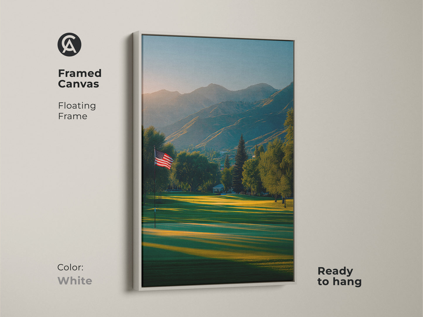 White framed canvas artwork print featuring a golf course. The American flag is a symbol of freedom. Mountains create a stunning backdrop. This floating frame art is ready to hang. Decorate your home now.