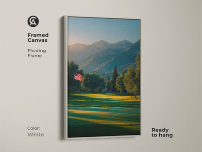 White framed canvas artwork print featuring a golf course. The American flag is a symbol of freedom. Mountains create a stunning backdrop. This floating frame art is ready to hang. Decorate your home now.