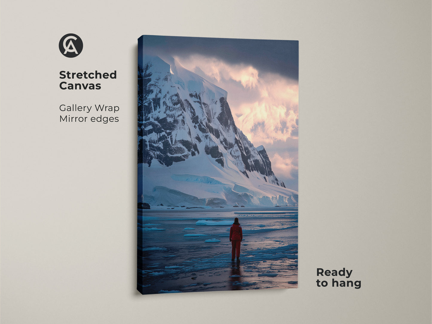 A stretched canvas print of an Antarctic scene. The artwork features a gallery wrap with mirrored edges making it ready to hang. It captures a solitary explorer in red against snowy mountains and icy waters.