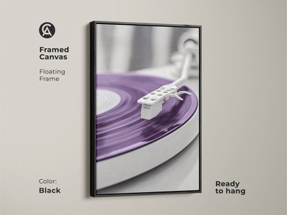 Black framed canvas print of a purple vinyl record. This minimalist mid-century modern turntable artwork is ready to hang. Perfect for adding a retro music vibe to your home office. A stylish gift for music enthusiasts and record collectors.