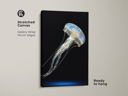 Stretched canvas featuring an abstract jellyfish. The blue and gold print uses minimalist ocean canvas art. Ready to hang marine life wall decor for a contemporary bedroom. A unique housewarming gift of abstract sea creature art.