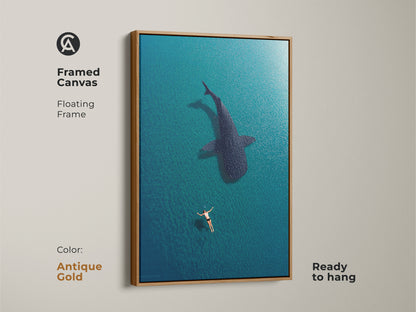 Antique gold framed canvas featuring a swimmer and whale shark in deep blue turquoise waters. This ready-to-hang coastal artwork adds a touch of elegance to any space. Ideal for marine wildlife enthusiasts seeking unique ocean-themed decor.