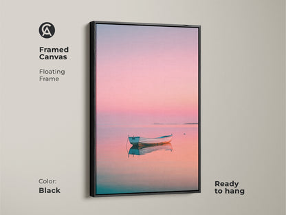 Framed canvas showcasing a boat at sunset. The floating frame is black. The artwork is ready to hang. Pastel colors add a peaceful touch. Shop framed art for your living room or bedroom.