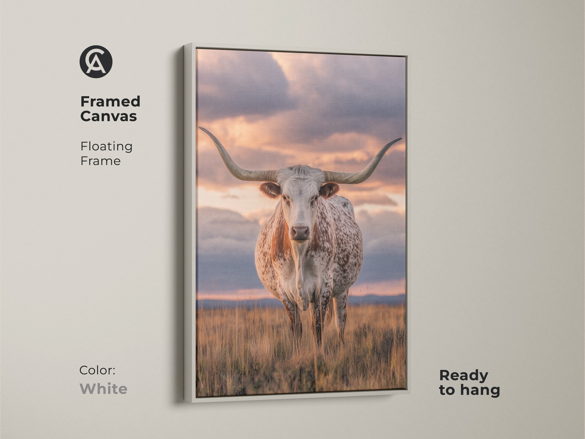 Framed Texas Longhorn canvas art with a white floating frame. Ready to hang this rustic home accent brightens your home. This savanna sunset landscape is perfect for farmhouse decor. A photorealistic animal print is a unique wildlife art.