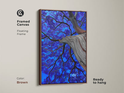 Framed violet and electric blue tree canvas art. The botanical artwork has a brown floating frame. It's a surreal nature wall decor piece. A unique tree art gift idea. Ready to hang for simple nature-inspired home decor.
