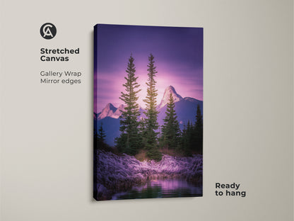 Stretched canvas art featuring a mountain landscape. Pine trees and a rocky shoreline under a violet sky. Gallery wrapped with mirrored edges. Ready to hang for modern outdoor wall art.