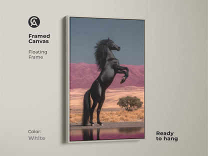 White Framed Canvas with Floating Frame of Black Horse Rearing. This equestrian wall hanging features a powerful stallion against a surreal desert backdrop. The pink mountains and blue sky create an eclectic bedroom artwork. Ready to hang this unique home decor gift is a fine art horse painting. It adds a dramatic flair to any interior.