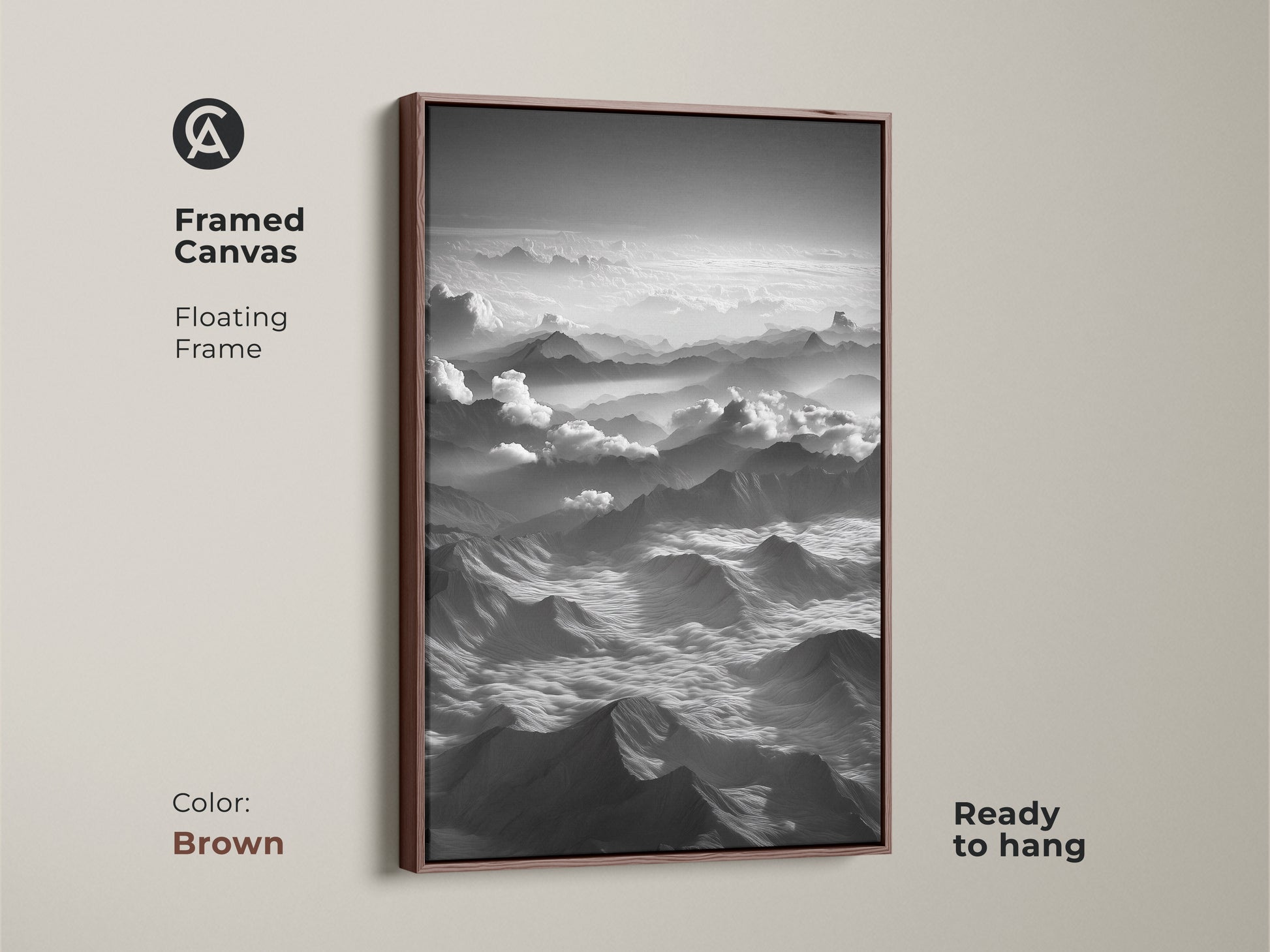 Framed canvas showcasing black and white mountain art. This aerial landscape artwork has a brown floating frame. The minimalist cloudscape wall decor is ready to hang. Great contemporary bedroom print.